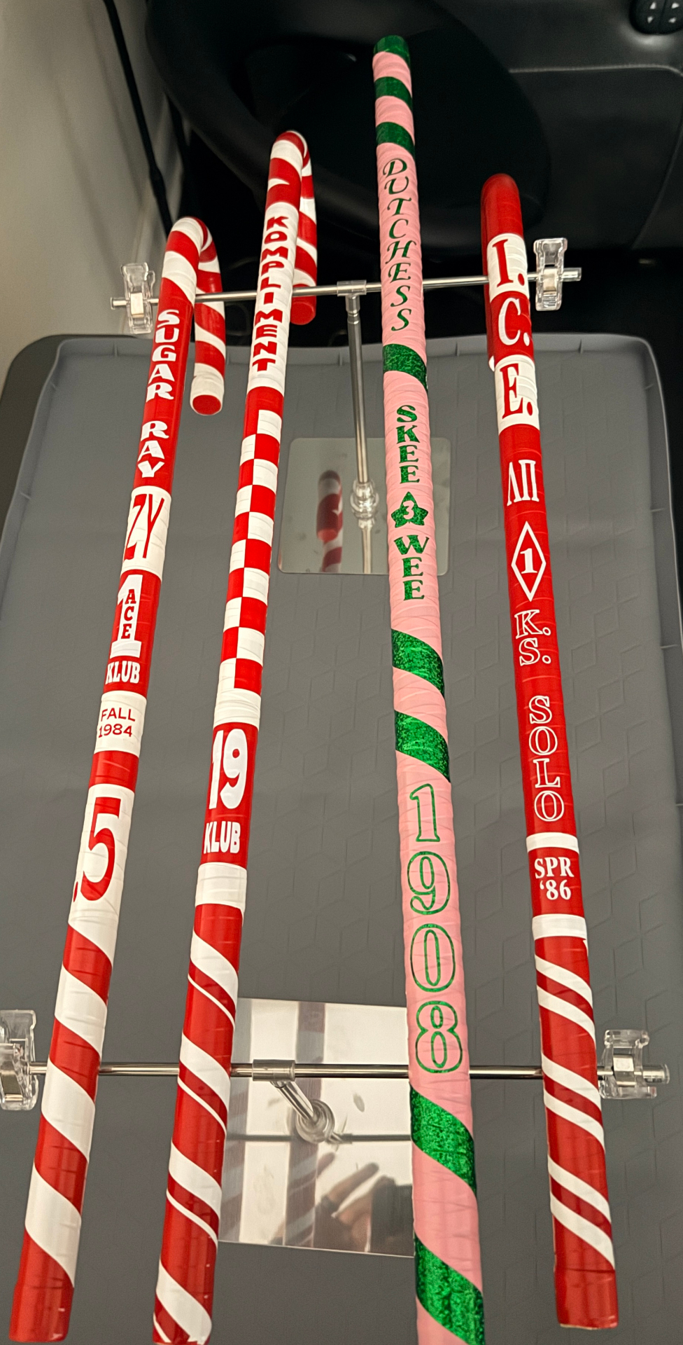 Five canes on rack including Dutchess Skee Wee 1908 and I.C.E. K.S. Solo